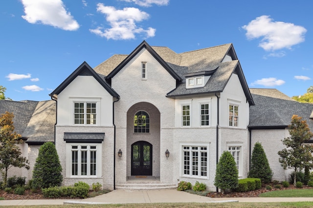 french country inspired facade with french doors