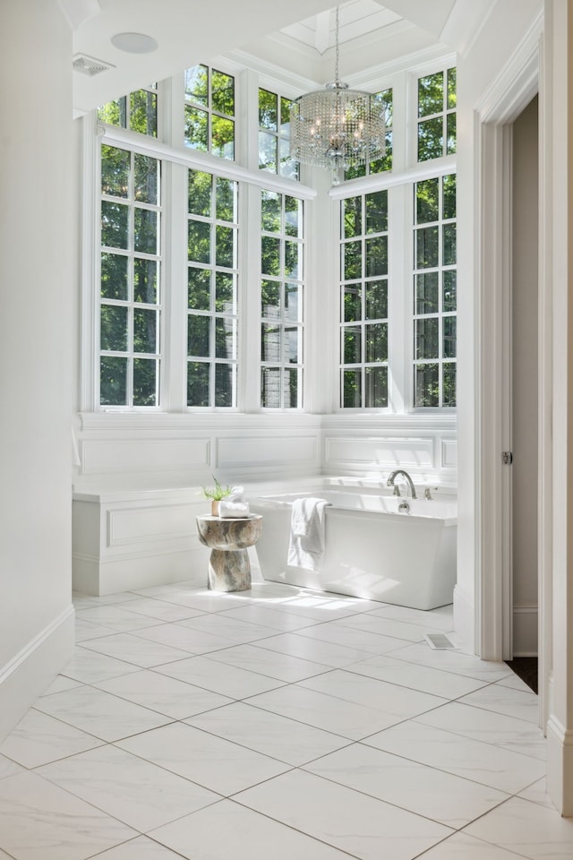 interior space with a chandelier and plenty of natural light