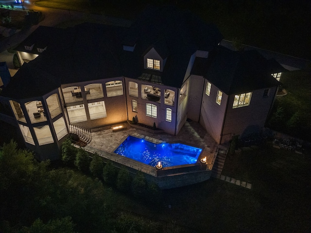 pool at twilight with a jacuzzi