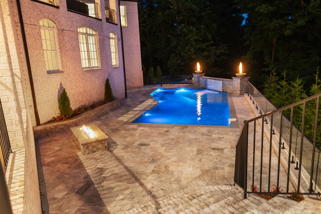 view of swimming pool with a patio and a jacuzzi