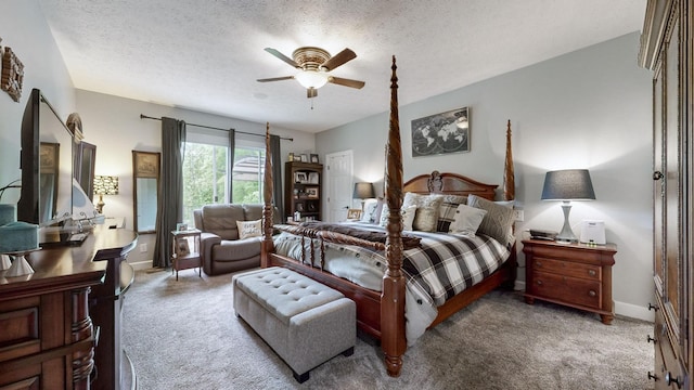 bedroom featuring ceiling fan, light colored carpet, and a textured ceiling