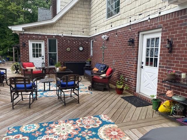 wooden deck featuring an outdoor hangout area