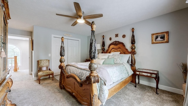 bedroom featuring carpet floors, a closet, and ceiling fan