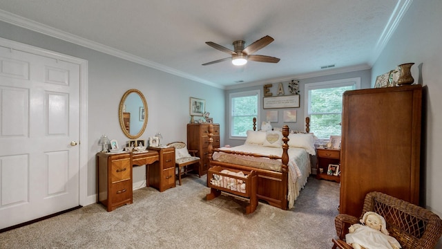 carpeted bedroom with crown molding and ceiling fan