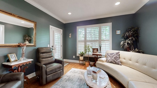 living room with ornamental molding and wood-type flooring