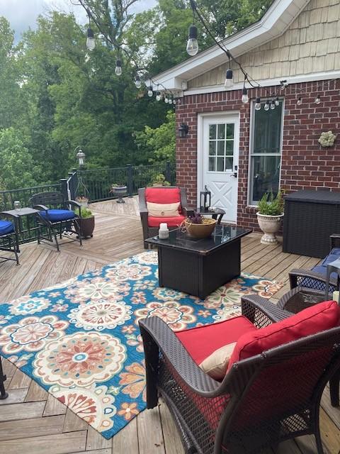 wooden deck with an outdoor living space