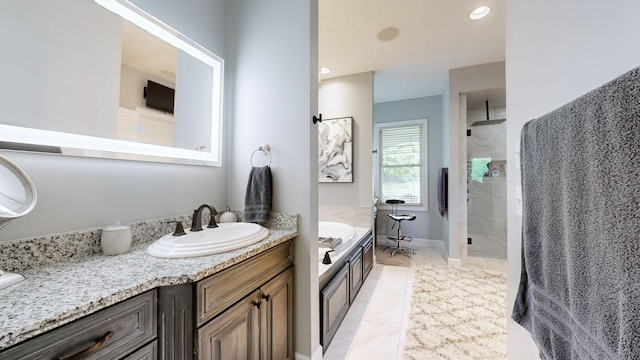 bathroom with vanity, tile patterned flooring, and separate shower and tub