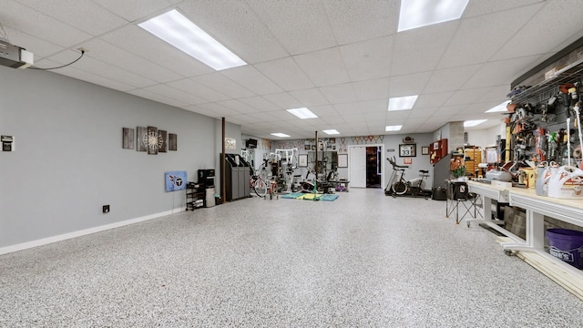 exercise area featuring a paneled ceiling