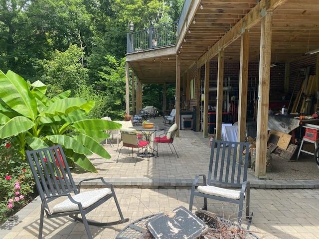 view of patio featuring a balcony