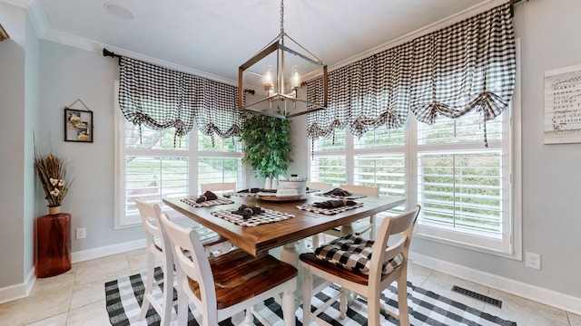 dining area with light tile patterned floors, crown molding, a notable chandelier, and a healthy amount of sunlight