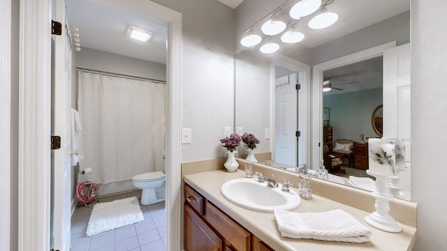 full bathroom with shower / bathtub combination with curtain, vanity, toilet, and tile patterned flooring