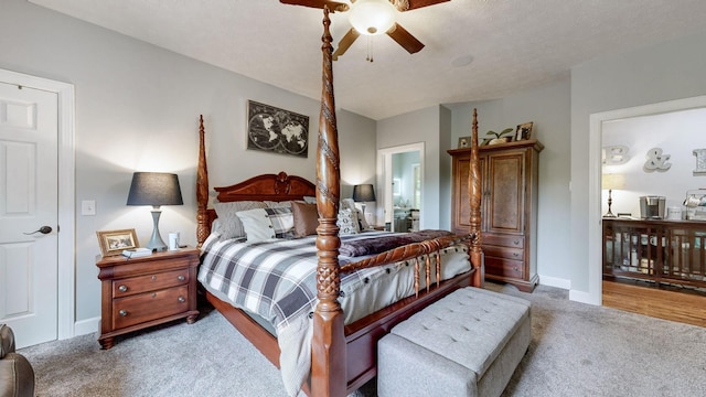 carpeted bedroom with ceiling fan