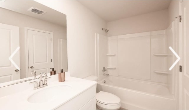 full bathroom with shower / tub combination, vanity, and toilet