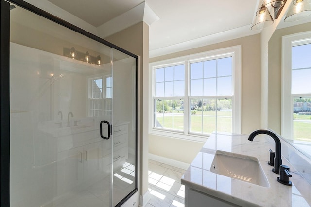 bathroom featuring vanity and a shower with door