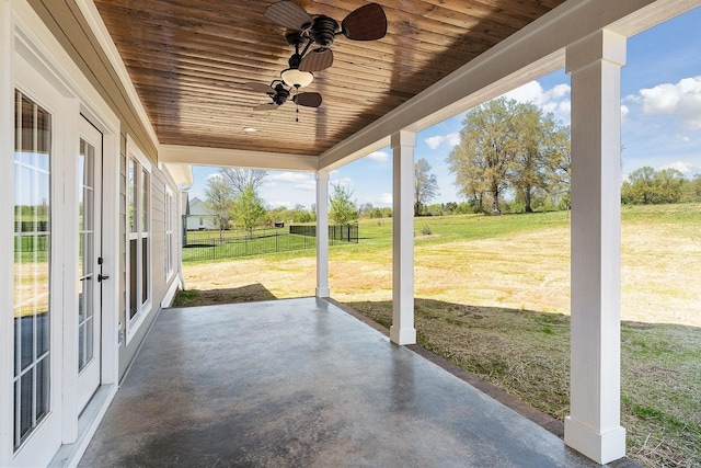 view of patio featuring ceiling fan and french doors