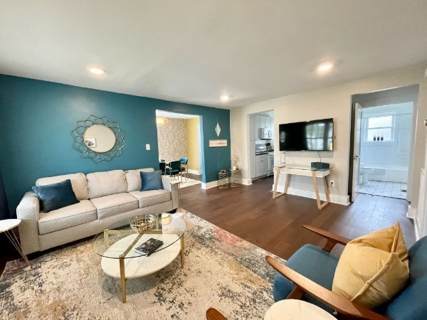 living room featuring dark hardwood / wood-style flooring