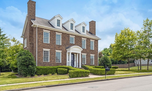 colonial home with a front yard