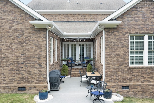 view of patio featuring a grill and french doors