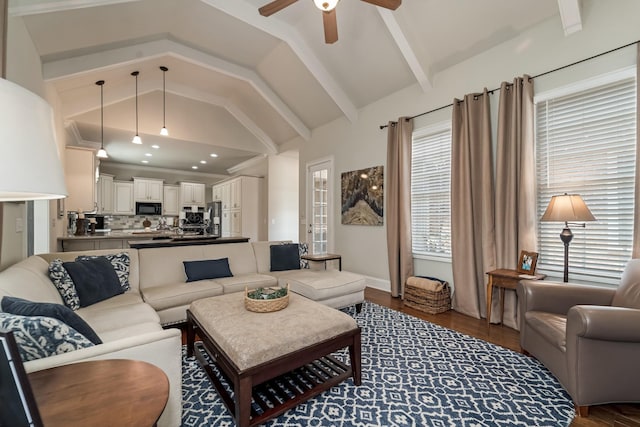 living room with beamed ceiling, high vaulted ceiling, dark hardwood / wood-style floors, and ceiling fan