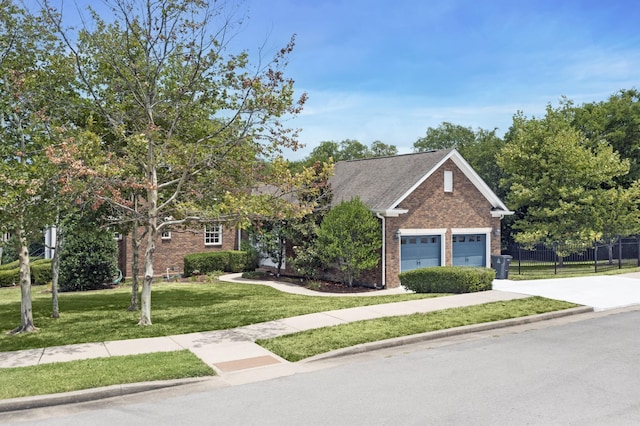 view of front of property featuring a garage and a front yard