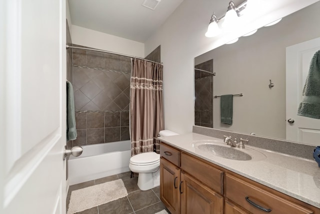 full bathroom featuring vanity, tile patterned floors, toilet, and shower / bath combo