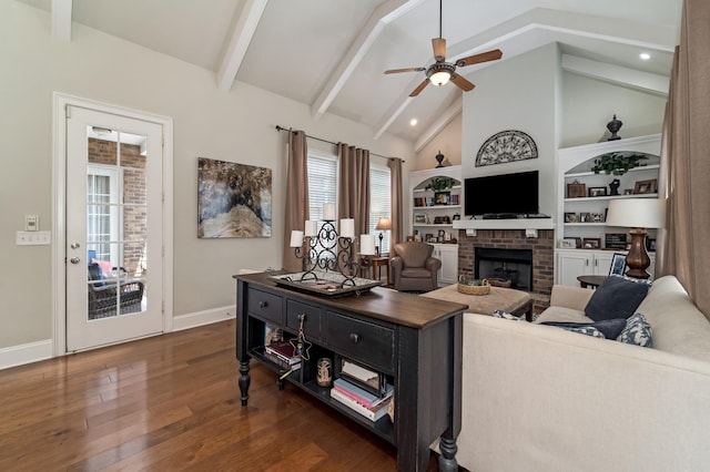 living room featuring ceiling fan, high vaulted ceiling, a fireplace, dark hardwood / wood-style flooring, and beamed ceiling