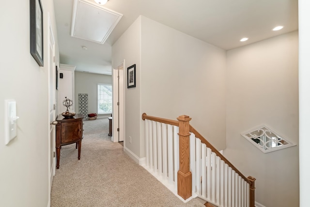 hallway with light carpet