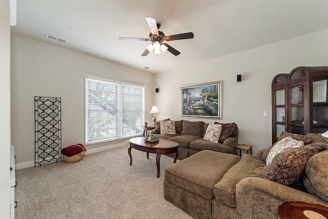 living room with light carpet and ceiling fan