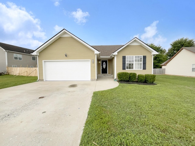 ranch-style home with a garage and a front lawn