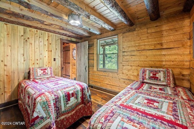 bedroom with wood ceiling, beam ceiling, and wooden walls