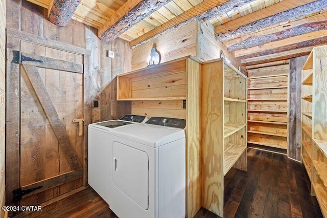 laundry room with separate washer and dryer, wood ceiling, wooden walls, and dark hardwood / wood-style floors