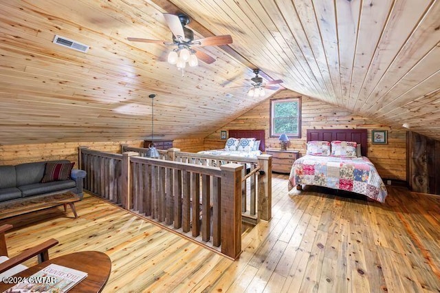 bedroom featuring wood ceiling, vaulted ceiling, light wood-type flooring, wooden walls, and ceiling fan