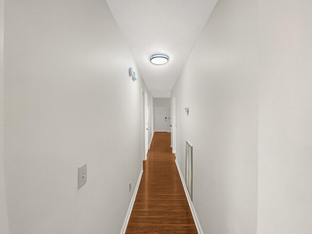 hall featuring dark wood-type flooring