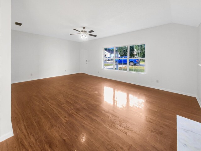 spare room with ceiling fan and dark hardwood / wood-style floors