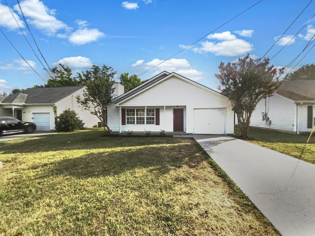 view of front of home featuring a front yard and a garage