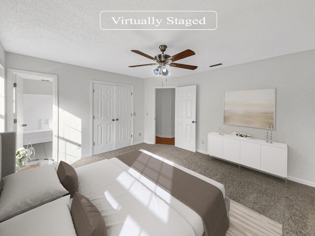 bedroom with ceiling fan, a textured ceiling, and carpet flooring