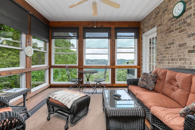 sunroom / solarium with wood ceiling and ceiling fan