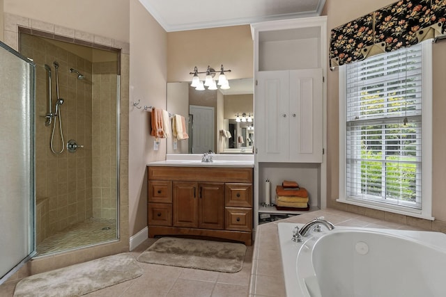 bathroom featuring vanity, tile patterned flooring, ornamental molding, and shower with separate bathtub