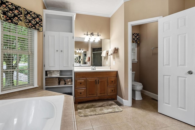 bathroom featuring toilet, ornamental molding, vanity, tiled bath, and tile patterned flooring