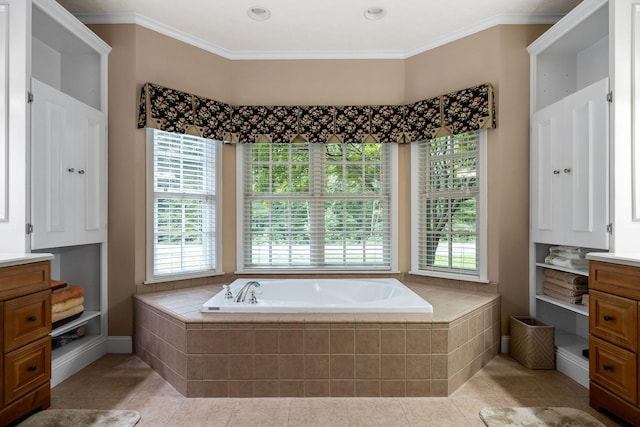 bathroom featuring vanity, tile patterned flooring, crown molding, and a wealth of natural light