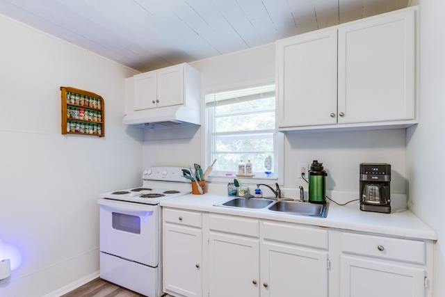 kitchen with sink, electric range, wooden ceiling, and white cabinetry