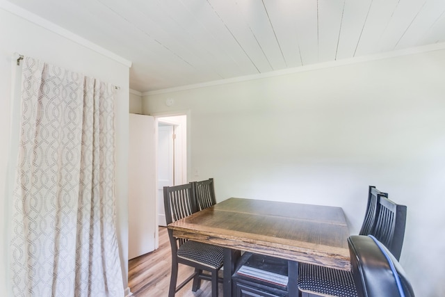 dining area with wooden ceiling, crown molding, and hardwood / wood-style floors