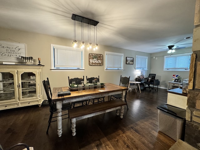 dining room with dark wood-type flooring and ceiling fan