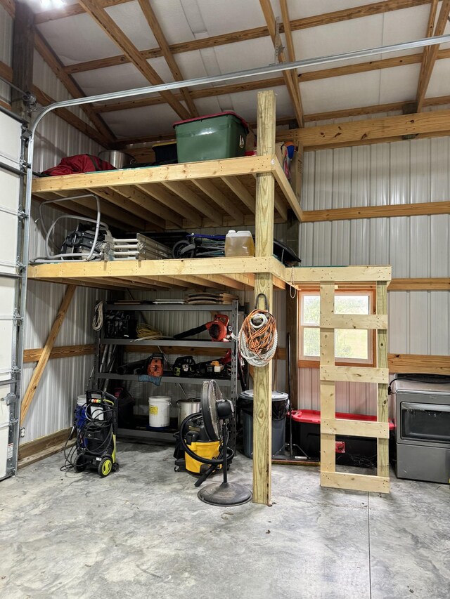 garage featuring washer / clothes dryer and a workshop area