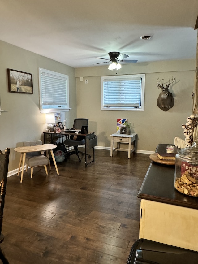 dining space featuring dark hardwood / wood-style floors and ceiling fan