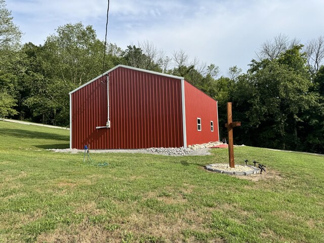 view of outbuilding with a lawn