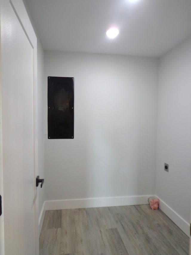 empty room with light hardwood / wood-style flooring