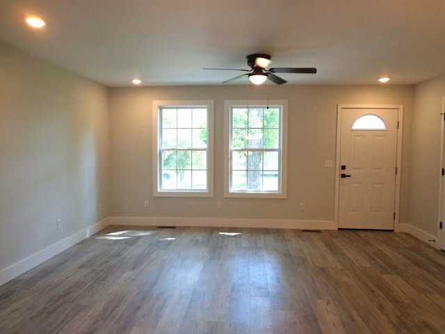 entrance foyer with dark hardwood / wood-style flooring and ceiling fan