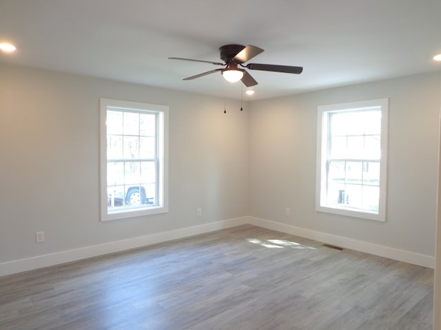 unfurnished room with light hardwood / wood-style flooring and ceiling fan