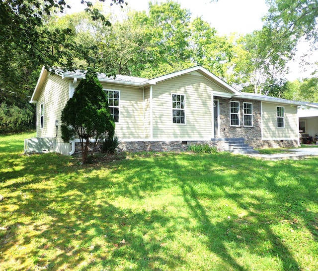 ranch-style house with a front lawn